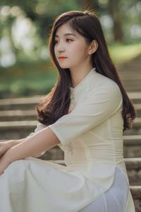 A beautiful young girl walking through a city park in the summer girl wallpaper