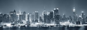 a black and white photo of a city skyline at night dual monitor wallpaper