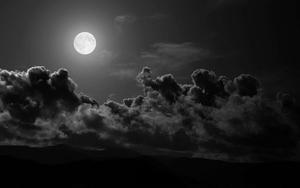 a black and white photo of the moon and clouds dark wallpaper