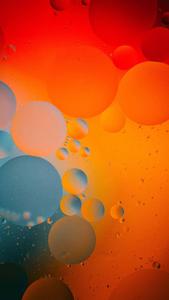 a blue and orange background iphone 13 wallpaper