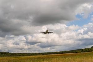 A breathtaking view of an airplane soaring through the sky Wallpaper