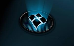 A Bright 3D Windows Logo Illuminated in the Darkness Wallpaper