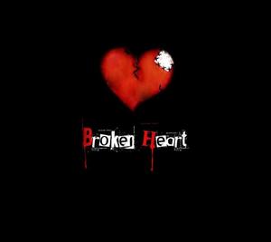 A Broken Heart Shattered on a Dark Black Background broken heart black wallpaper