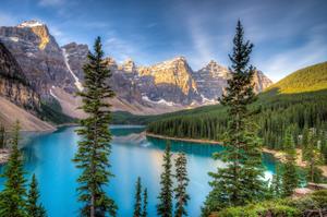 A captivating sunset view of a tranquil lake and emerald forest. beautiful wallpaper