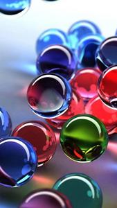 A captivating view of colorful 3D transparent balls Wallpaper