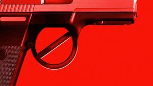 A close up of a black handgun gun wallpaper