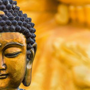 A close-up of a stunning golden Buddha statue buddha wallpaper