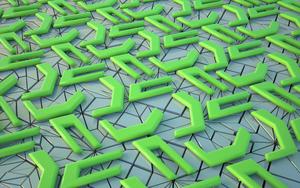 A collage of 3D shapes in varying green tones Wallpaper
