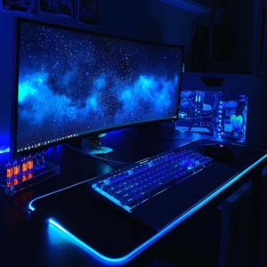 a computer desk with a blue light on it 4k gaming wallpaper