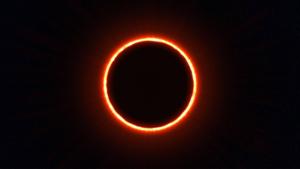 A double eclipse in the dark blue sky 8k wallpaper