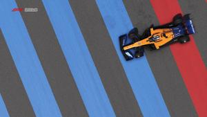 A dynamic race with McLaren F1 on red and blue track lines f1 wallpaper