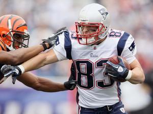 a football player is running with the ball football wallpaper