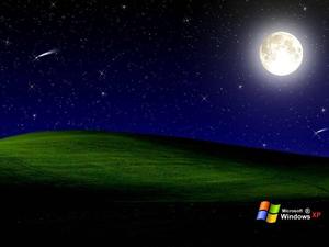 a full moon is seen over a green field windows xp wallpaper