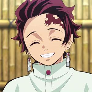 a girl with red hair and earrings is smiling tanjiro wallpaper