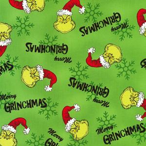 a green fabric with a grinch hat and a christmas tree grinch wallpaper
