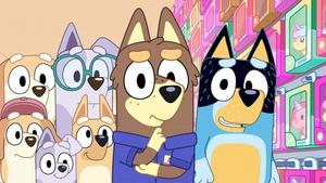 a group of cartoon dogs standing in front of a store bluey wallpaper