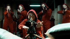 a group of people in red suits with guns money heist wallpaper