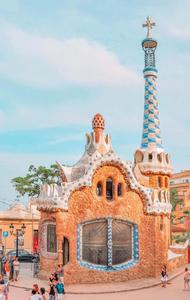a group of people walking around a building in barcelona barcelona wallpaper