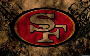 A grungy royal pattern featuring the iconic San Francisco 49ers logo. Wallpaper