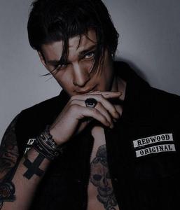 A handsome bad boy in a black leather jacket bad boy wallpaper