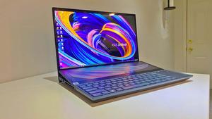 a laptop with a keyboard on top of it Wallpaper