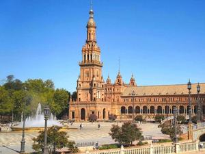 a large square with a fountain and a clock tower barcelona wallpaper