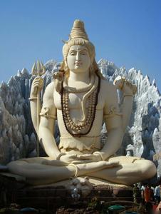 a large statue of lord shiva in front of a mountain lord shiva wallpaper