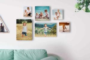 a living room with several photos on the wall aesthetic collage wallpaper