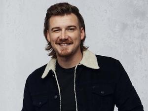 a man in a black jacket and black shirt smiling morgan wallen wallpaper
