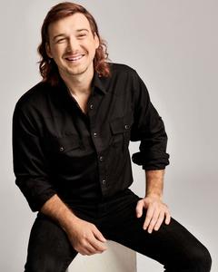 a man in a black shirt is smiling morgan wallen wallpaper