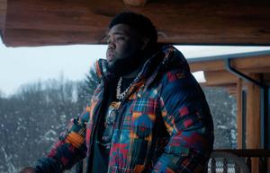 a man in a colorful jacket standing on a porch rod wave wallpaper