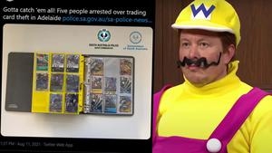 a man in a mario costume is holding a card trading wallpaper
