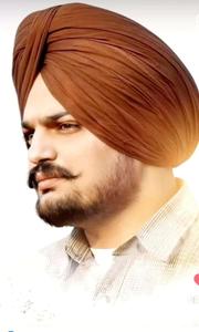 a man in a turban is wearing a turban Wallpaper