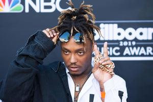 a man with dreadlocks and a chain on his wrist juice wrld wallpaper