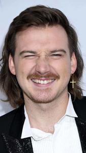 a man with long hair and a cross necklace morgan wallen wallpaper
