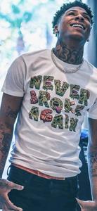 a man with tattoos and a t - shirt that says never broke again nba youngboy wallpaper