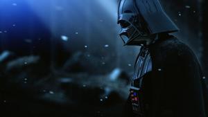 A menacing Darth Vader stands ready to face his enemies Wallpaper