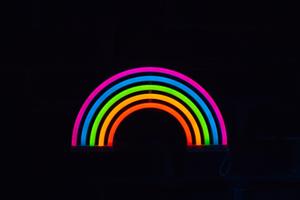 A mesmerising display of neon hues in darkness black screen wallpaper