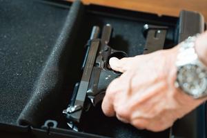 A modern gun during a target practice session gun wallpaper
