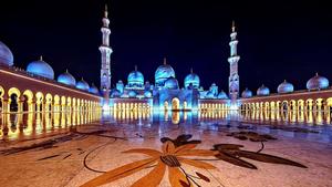 a mosque lit up at night islamic wallpaper