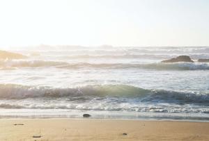 A peaceful beach day with the waves rolling in. beach wallpaper