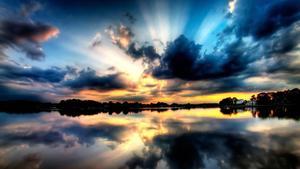 A picturesque sunset reflected in the still water. 1080p wallpaper