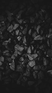 A Pile of Black Stones black wallpaper