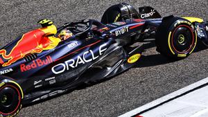 a red bull racing car is driving on a track f1 wallpaper