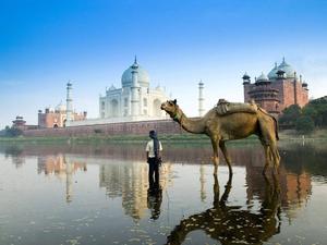 A Serene Scene of a Mosque Overlooking a Glittering Lake islamic wallpaper