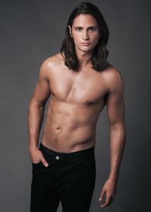 a shirtless man posing for a photo Wallpaper