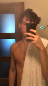a shirtless man taking a selfie in a bathroom aesthetic boy wallpaper