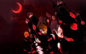 A silhouette of Akatsuki outlined in a red moon, standing vigilant against all adversaries Wallpaper