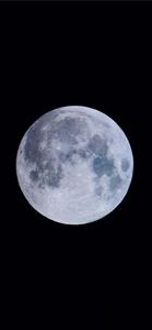 A single ray of moonlight casts its reflection upon a midnight black iPhone. the moon iphone wallpaper