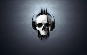 A skull with headphones and a guitar skull wallpaper
